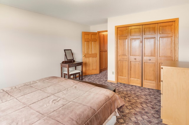 carpeted bedroom featuring a closet