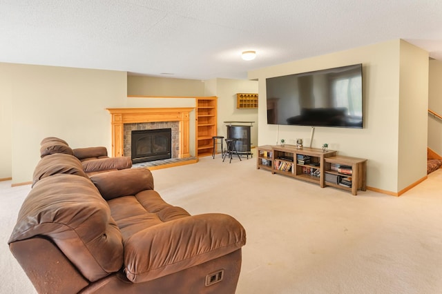carpeted living room with baseboards and a fireplace