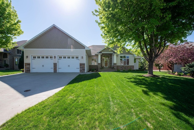 26 Deerwood Ct, North Mankato, MN 56003 - craftsman house with a garage, driveway, stone siding, and a front lawn