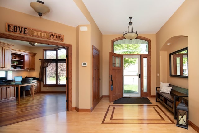 26 Deerwood Ct, North Mankato, MN 56003 - foyer entrance featuring light wood finished floors, built in study area, and baseboards