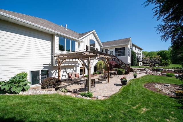 26 Deerwood Ct, North Mankato, MN 56003 - rear view of property featuring a pergola, a patio area, a lawn, and roof with shingles