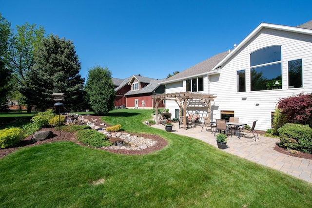 26 Deerwood Ct, North Mankato, MN 56003 - view of grassy yard featuring a pergola and a patio