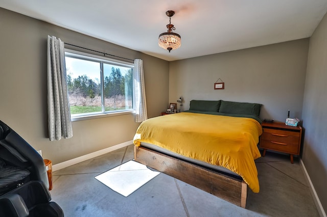 carpeted bedroom featuring baseboards