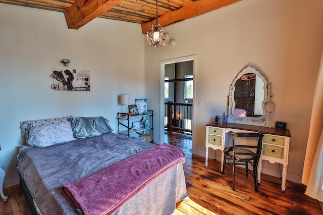 bedroom featuring beam ceiling, wood-type flooring, a chandelier, baseboards, and wood ceiling