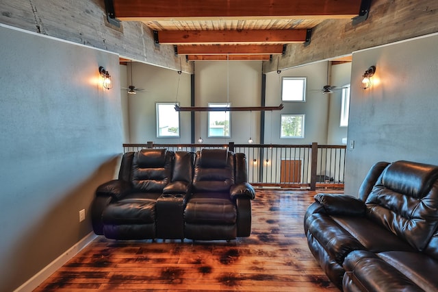 cinema room with wood ceiling, ceiling fan, a healthy amount of sunlight, and hardwood / wood-style flooring