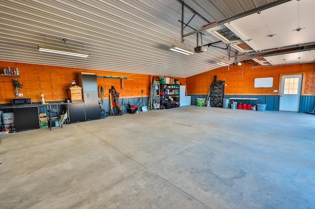 garage featuring a workshop area and a garage door opener
