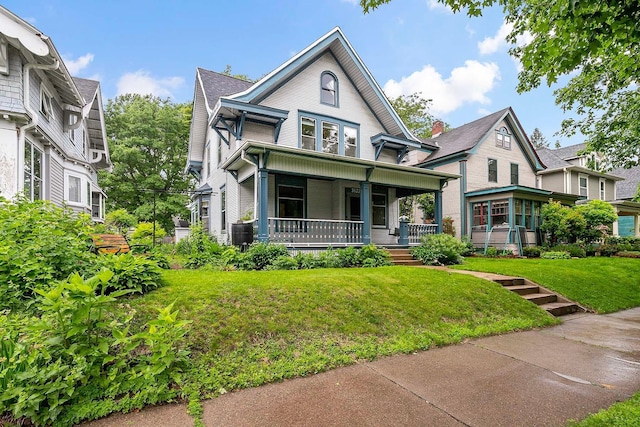 3622 Pleasant Ave, Minneapolis, MN 55409 - victorian-style house with covered porch and a front yard