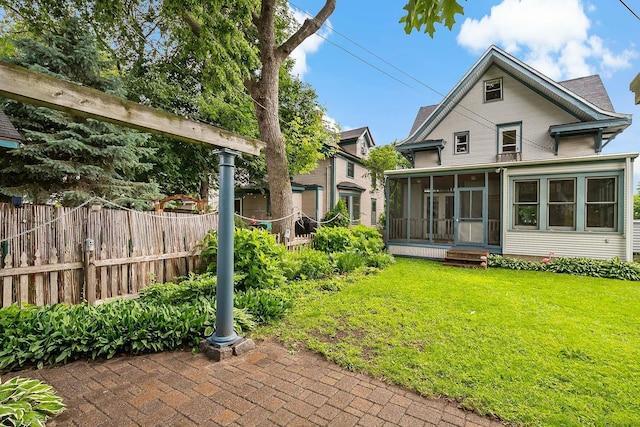 3622 Pleasant Ave, Minneapolis, MN 55409 - rear view of property featuring a sunroom