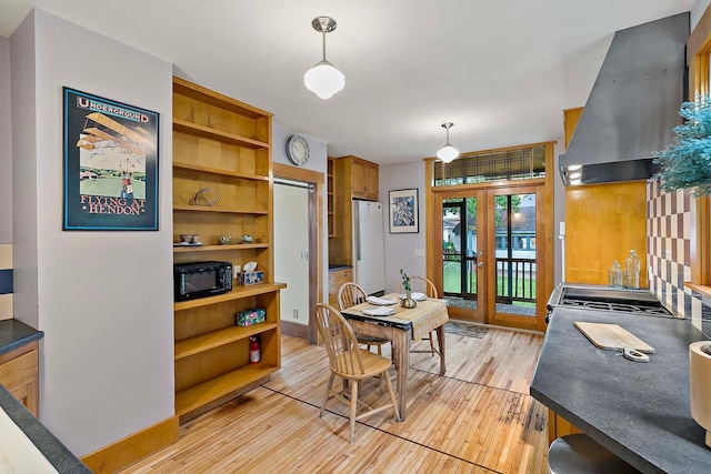 3622 Pleasant Ave, Minneapolis, MN 55409 - dining area with french doors and light wood-type flooring