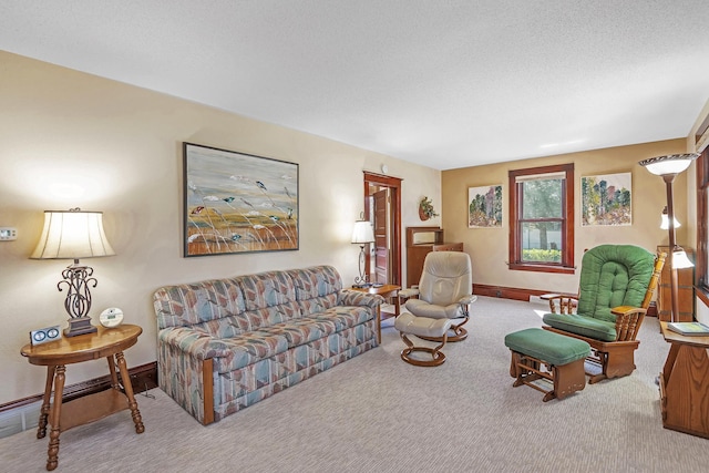 carpeted living area featuring baseboards