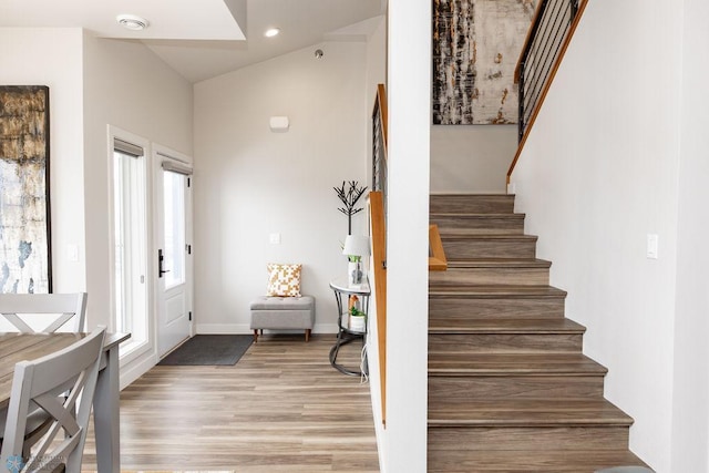 interior space with stairway, recessed lighting, baseboards, and light wood-type flooring