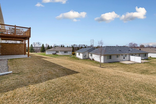 view of yard featuring a patio and a deck