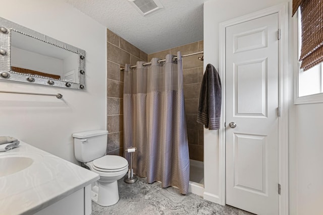 full bath with a shower stall, a textured ceiling, vanity, toilet, and visible vents