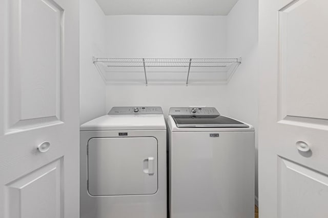 washroom with washer and dryer and laundry area