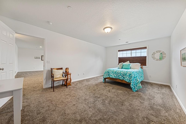 carpeted bedroom with baseboards and a textured ceiling