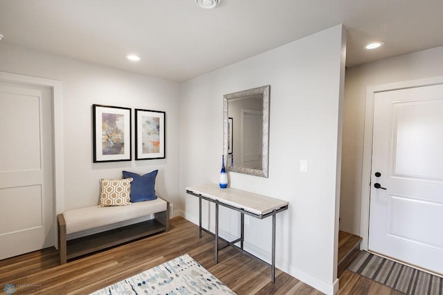 foyer entrance featuring baseboards, recessed lighting, and wood finished floors