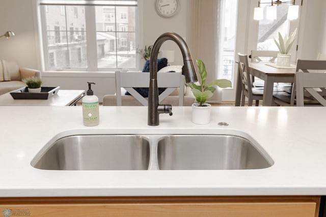interior details featuring a sink and light countertops
