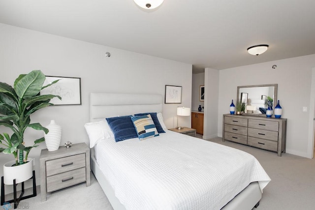 bedroom with light colored carpet