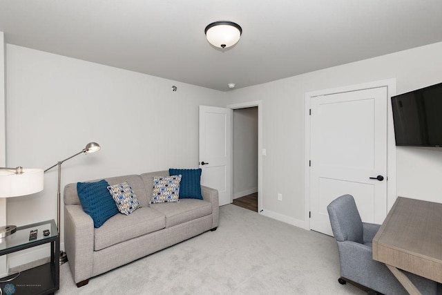 office area featuring light colored carpet and baseboards