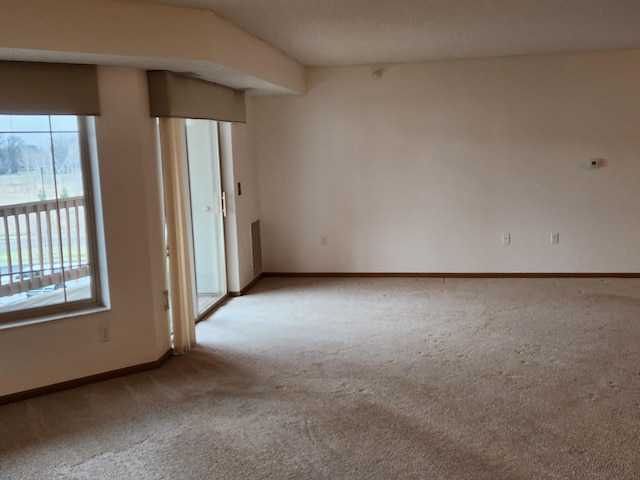 2155 6th Ln SE Unit 301, Cambridge, MN 55008 - carpeted empty room with healthy amount of natural light