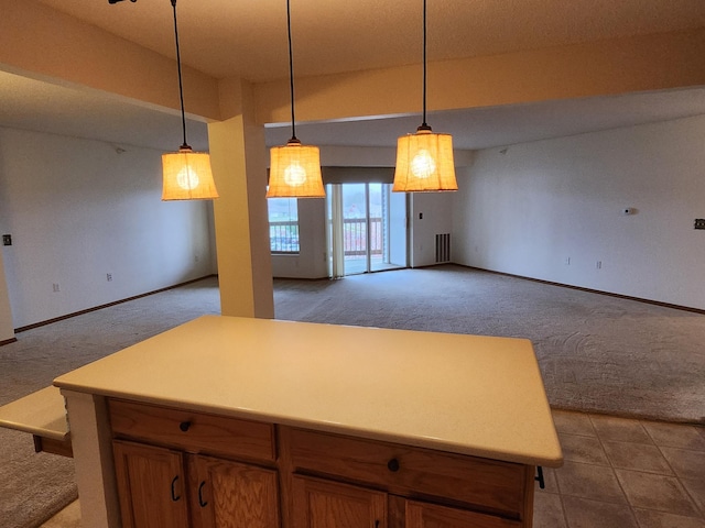 2155 6th Ln SE Unit 301, Cambridge, MN 55008 - kitchen featuring carpet, open floor plan, and pendant lighting