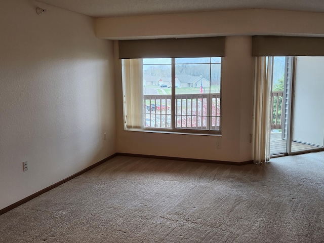 2155 6th Ln SE Unit 301, Cambridge, MN 55008 - carpeted empty room featuring baseboards