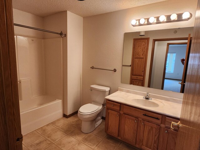 2155 6th Ln SE Unit 301, Cambridge, MN 55008 - bathroom with a textured ceiling, vanity, tile patterned flooring, and tub / shower combination