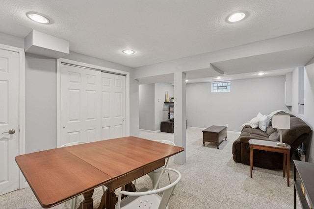 office featuring light carpet, recessed lighting, and a textured ceiling