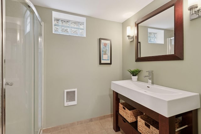 bathroom with visible vents, tile patterned flooring, vanity, baseboards, and a stall shower