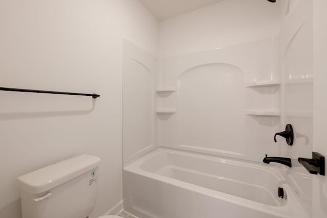 bathroom with toilet and  shower combination