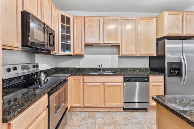 7100 Metro Blvd Unit 116, Edina, MN 55439 - kitchen with appliances with stainless steel finishes, light brown cabinets, a sink, glass insert cabinets, and dark stone countertops