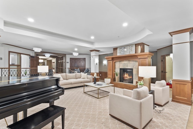 7100 Metro Blvd Unit 116, Edina, MN 55439 - living room featuring a tray ceiling, recessed lighting, a fireplace, a decorative wall, and wainscoting