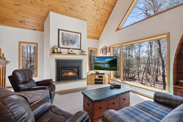 living room with a glass covered fireplace, carpet flooring, wooden ceiling, and high vaulted ceiling