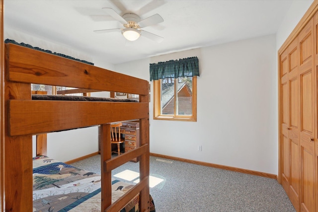 bedroom with carpet floors, baseboards, and a ceiling fan