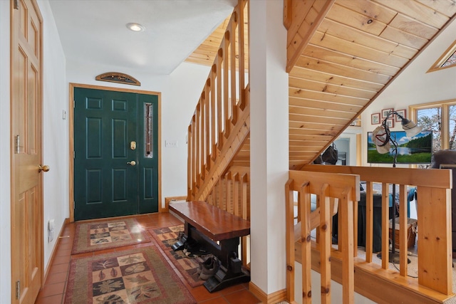 entryway featuring stairs, baseboards, tile patterned floors, wooden ceiling, and recessed lighting