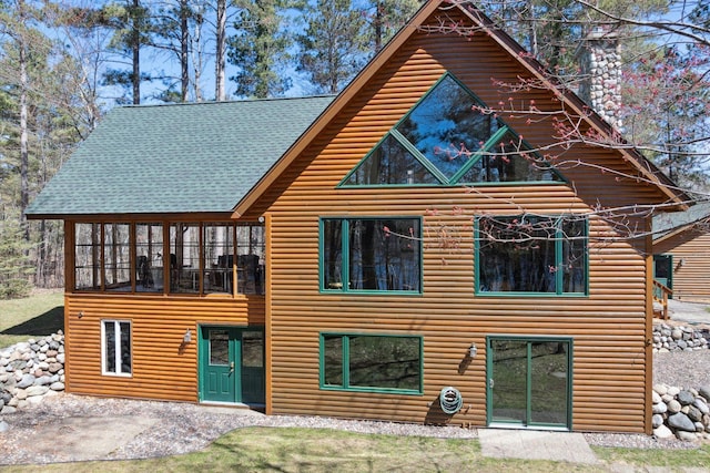 view of front of house featuring faux log siding