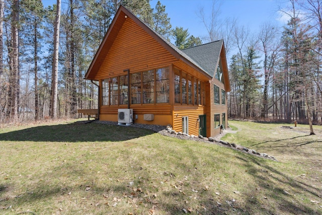 view of property exterior with ac unit, a sunroom, roof with shingles, a lawn, and log veneer siding