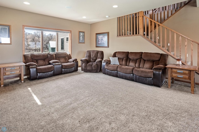 living area with carpet flooring, recessed lighting, and stairs