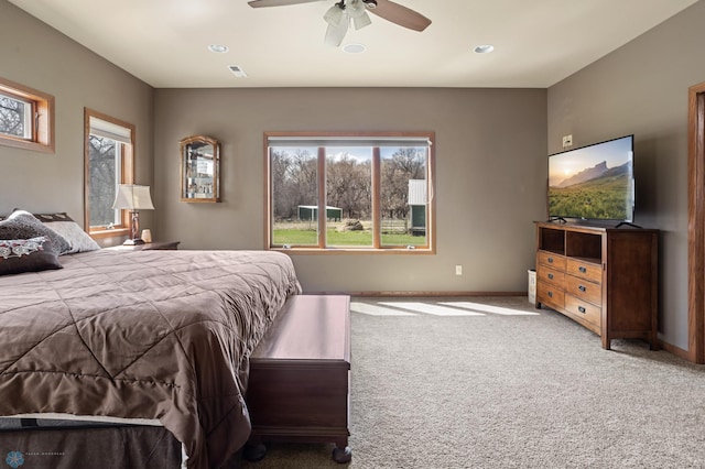 bedroom with carpet floors, a ceiling fan, baseboards, and visible vents