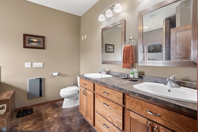 full bathroom featuring a sink, toilet, double vanity, and visible vents