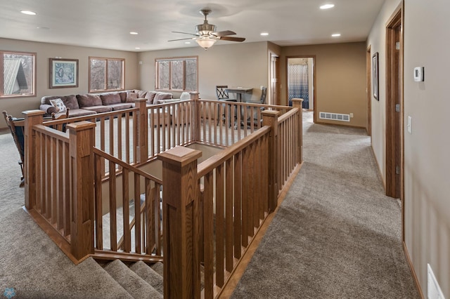 stairs featuring visible vents, carpet flooring, baseboards, and recessed lighting