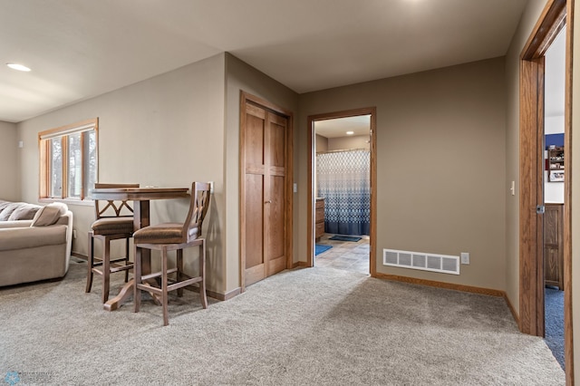interior space with baseboards, carpet flooring, recessed lighting, and visible vents