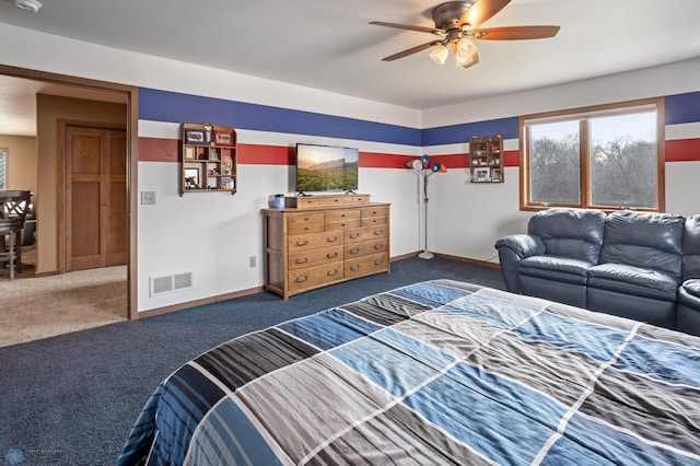 carpeted bedroom featuring baseboards, a ceiling fan, and visible vents