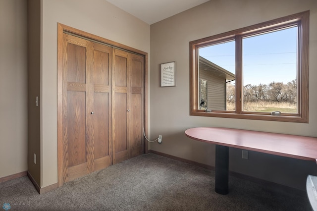 interior space featuring baseboards