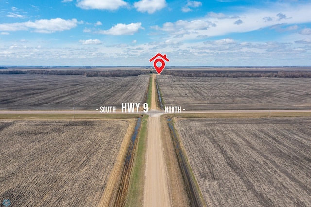 birds eye view of property with a rural view