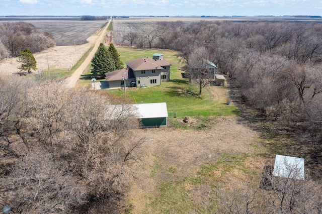 birds eye view of property with a rural view