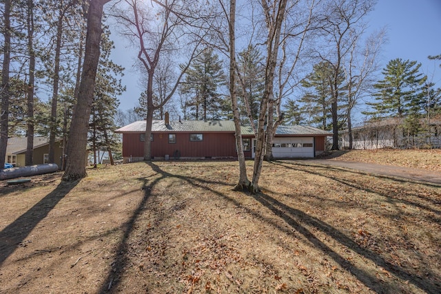 exterior space with a garage and driveway
