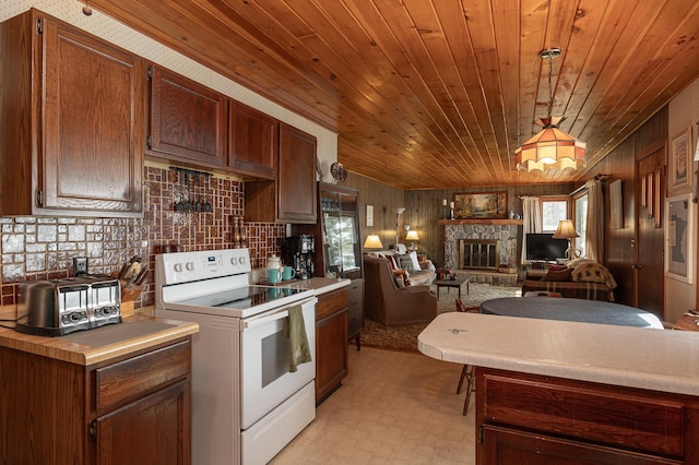 kitchen with wood ceiling, white range with electric stovetop, a healthy amount of sunlight, and a stone fireplace