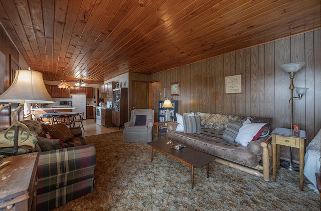 living room with wooden ceiling and wood walls