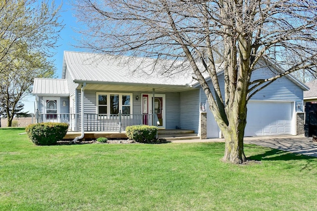 155 Nicholas Dr, Lewiston, MN 55952 - view of front of home with a porch, an attached garage, concrete driveway, a front yard, and a metal roof